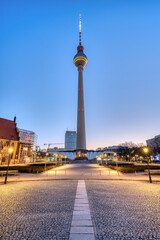 Fototapeta na wymiar The Alexanderplatz with the famous TV Tower in Berlin with no people at dawn