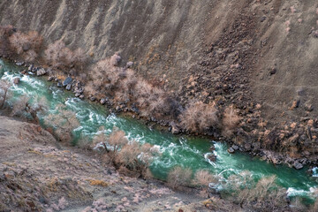 Beautiful Sharyn river is flowing in Black canyon. Scenic background. Travel, tourism in Kazakhstan concept.