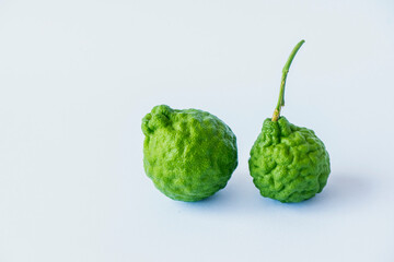 Two fresh kaffir lime fruits