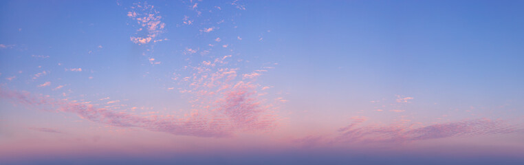 Fototapeta premium panorama photo of picturesque sky with spindrift clouds on sunrise