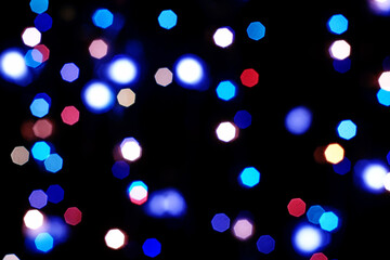 Naklejka premium multicolored burning lights in a blur on a black background background screensaver