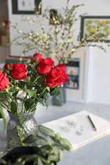 Bouquet of red roses on the table in the interior