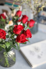 Bouquet of red roses on the table in the interior