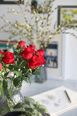 Bouquet of red roses on the table in the interior