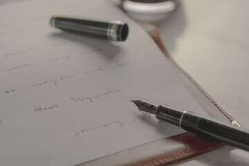 Fountain pen on a letter