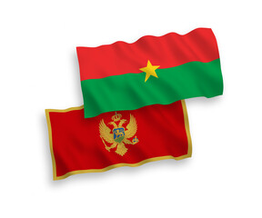 National vector fabric wave flags of Montenegro and Burkina Faso isolated on white background. 1 to 2 proportion.