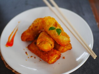 Selective focus risoles sosis mayo (American risoles) or mayonnaise sausage rissole is a small patty rolled in breadcrumbs. it is filled with mayonnaise, boiled egg and sausage.