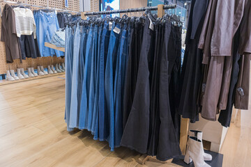 men's trousers on hangers in the store