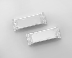 White plain empty two candy bars with glossy packaging on isolated background