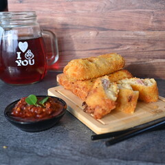 Selective focus risoles sosis mayo (American risoles) or mayonnaise sausage rissole is a small patty rolled in breadcrumbs. it is filled with mayonnaise, boiled egg and sausage.