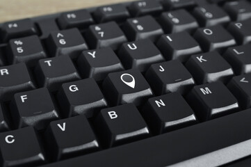 Map pin point location icon on black computer keyboard button, Map pointer navigation online concept
