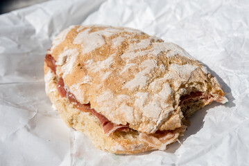 Bitten ham sandwich with rustic bread