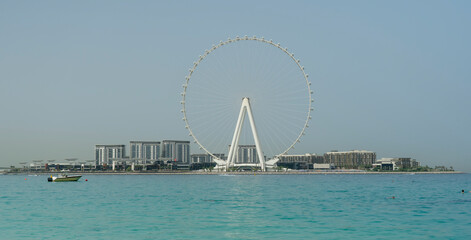 Obraz premium Dubai, United Arab Emirates. Amazing aerial view of the Ain Dubai and the Bluewaters Island. The world’s tallest and largest observation wheel. An iconic landmark close to Dubai Marina