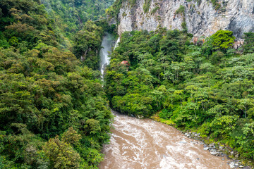 El Pailon del Diablo waterfall cascade and suspended bridge. Aerial view. Banos Santa Agua, Ecuador. South America.