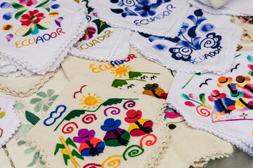 Fototapeta na wymiar Colorful Andean fabric textiles on the local souvenir market in Otavalo, Ecuador. South America.