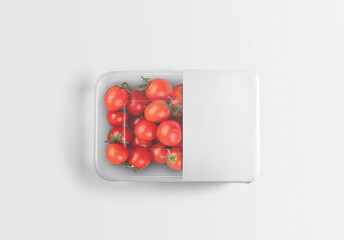 Transparent plastic tomato container tray with plain and empty packaging label on isolated background. 