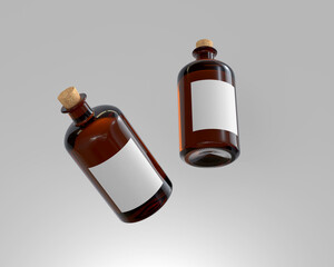 Two flaoting gin amber bottles with plain and blank white label 