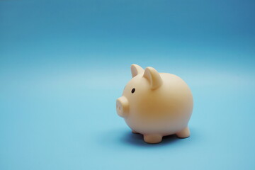 Piggy banks saving with space copy on blue background