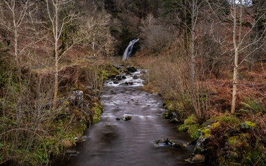 Fototapeta premium Grey Mare's Tail Waterfall and burn in winter, Galloway Forest Park, Scotland