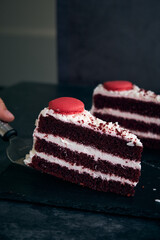 two pieces of red velvet cake with cookies on top
