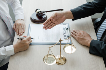 A man lawyer or a judge counseling clients about judicial justice and prosecution with scales,...