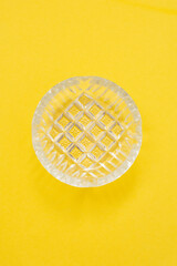 glass ashtray from Soviet times on a yellow background