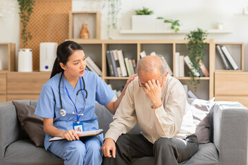 Obraz premium The doctor put her hand on the shoulder of worried old man, caring and comforting depressed unhealthy mature. Young Asian psychiatrist give advice to elder patient for elderly health care