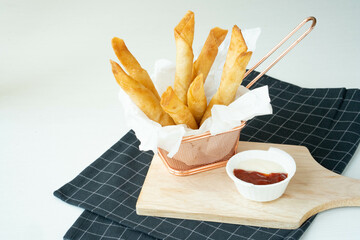 Homemade Fried Breaded mozzarella cheese sticks served with tomato sauce and mayonnaise