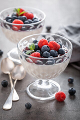 Traditional and sweet Panna Cotta served in glass with mousse.