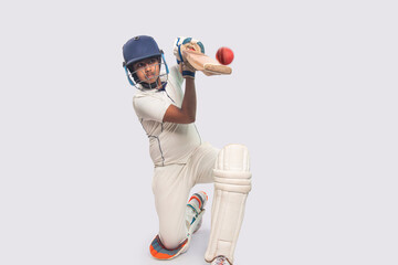 Portrait of boy hitting a shot  During a Cricket Game