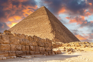 Fototapeta na wymiar Pyramids of Giza, Cairo, Egypt at sunset. Built by the Pharaohs as a tomb and passage to the afterlife, where they believed they would be Gods.