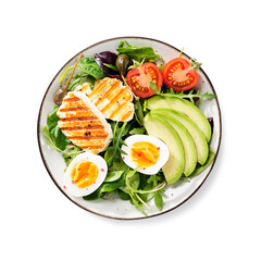 Healthy keto diet breakfast: boiled egg, avocado slices, grilled halloumi cheese, salad leaves. Isolated on white background. top view