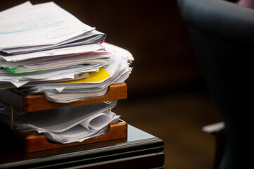 Pile of unfinished documents on office desk, Stack of business paper