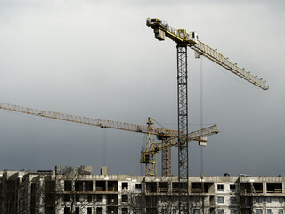 Construction of a residential building. Construction cranes