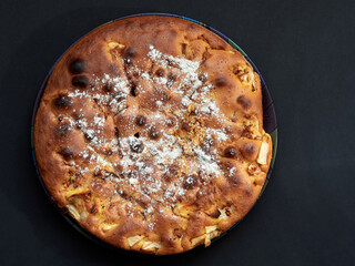 Homemade apple pie on a dark background