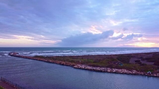 Aerial view of the pier at the mouth of Fiora river in Montalto di Castro, Lazio