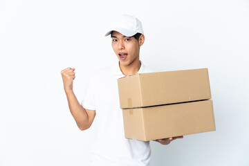 Delivery Chinese man isolated on white background celebrating a victory