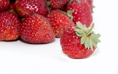 Strawberries on a white background. Strawberry close-up isolated. Juicy berries picked for dessert.