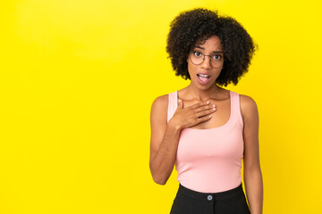 Fototapeta na wymiar Young African American woman isolated on yellow background pointing to oneself