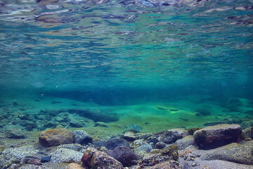 ocean underwater rays of light background, under blue water sunlight