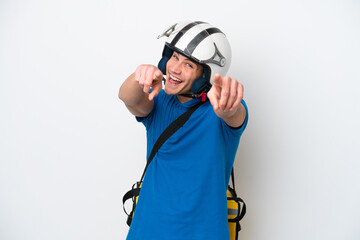 Young caucasian man with thermal backpack isolated on white background points finger at you while smiling