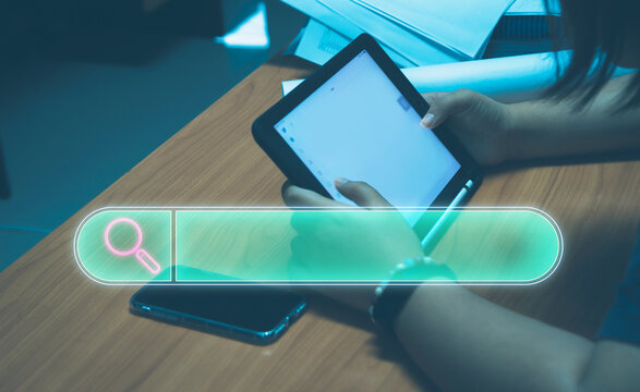 Searching for information. Using data search bar functionality on devices webpage technology internet networking business.