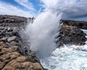 wave crashing on rocks