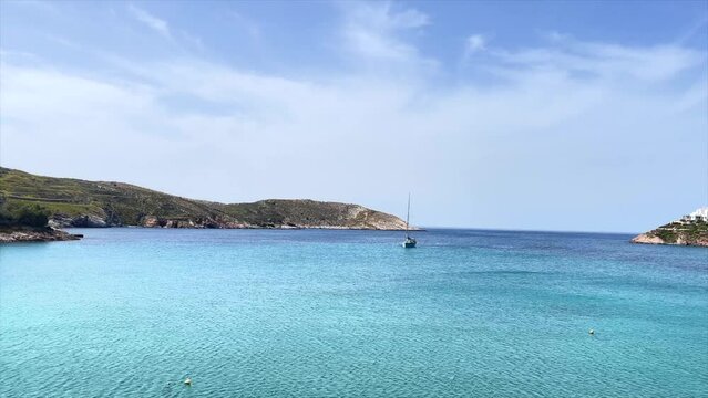 Sailboat. Isolated.. Movie No Audio.  Boat anchored in the middle of a bay on a  very calm day on a Greek Island. Stock Footage.
3
