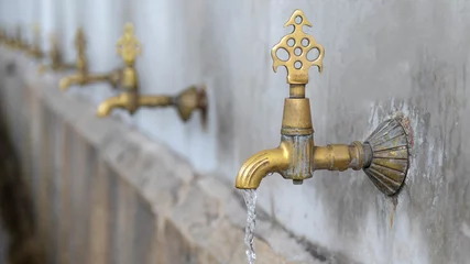 Deurstickers yellow faucet and row fountain © emrah