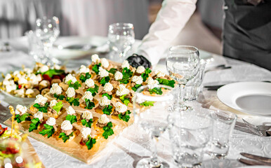 waiter holds plate with food. Restaurant service. buffet or catering.