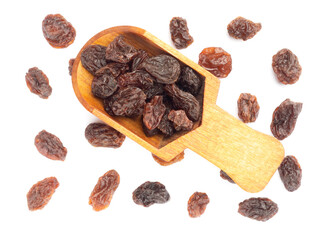 Raisin in scoop and bunch isolated on white background. Macro. Vegetarian concept