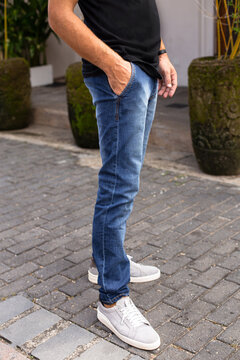 Men's blue jeans trousers, a fashion photo for the catalog, for a banner, close-up.