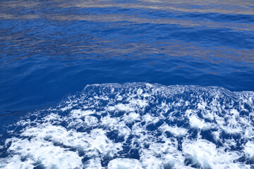 blue water of mediterranean sea with sea foam