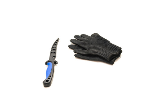 Close-up fish fillet knife with pair of black glove cut resistant for fish fillet processing, food grade protection isolated on white